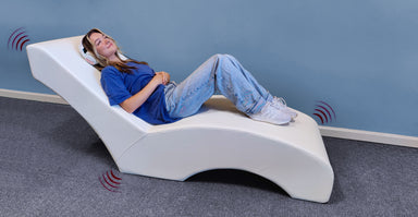 Experia vibro lounger with headphones lying down side view