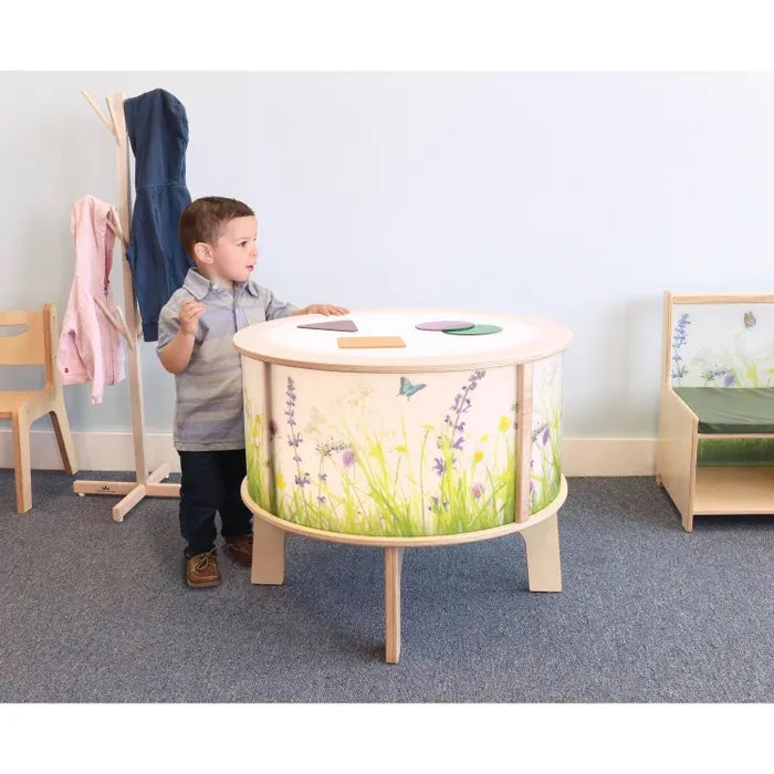 Nature view radiant LED light table side view with participant.